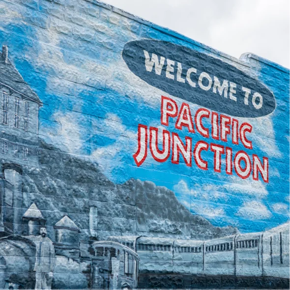 Welcome to Pacific Junction mural depicting the community’s railroad history